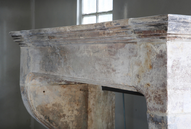 antique fireplace of limestone