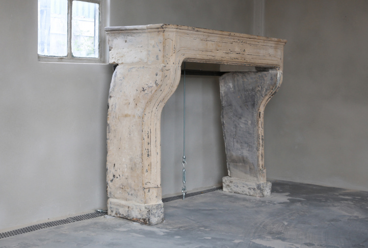 antique fireplace of limestone