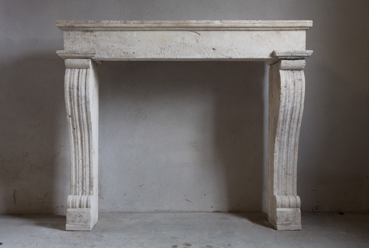 antique fireplace of limestone