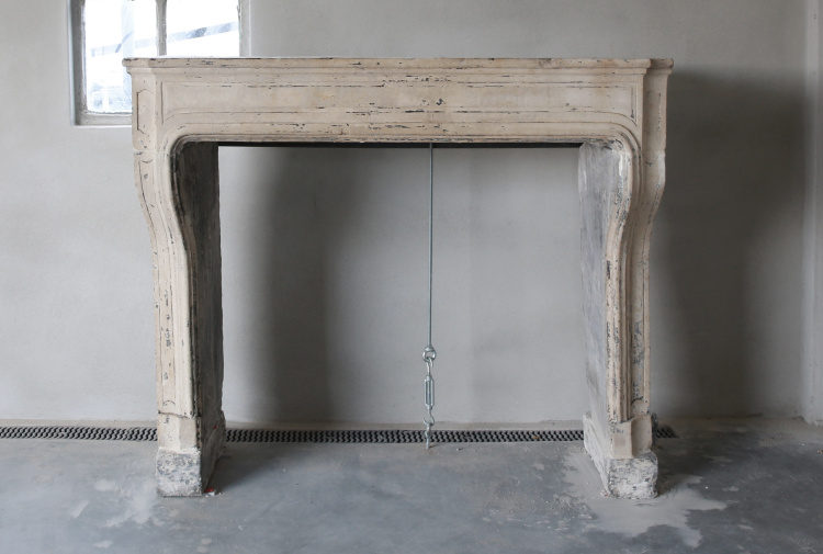 antique fireplace of limestone